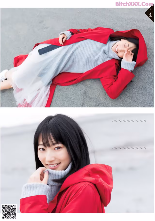 A woman in a red jacket laying on the ground.
