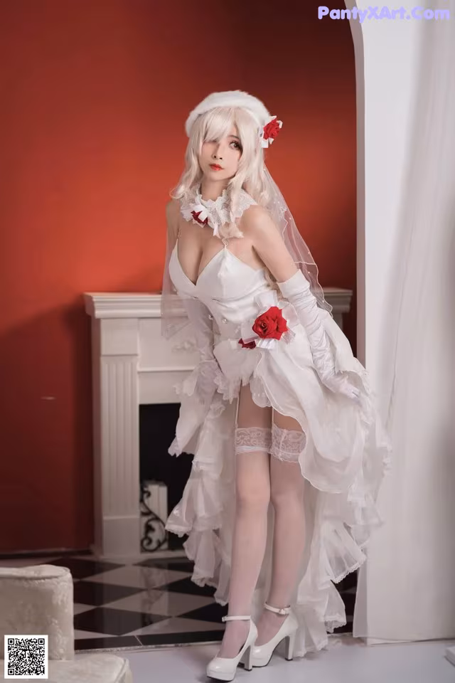 A woman in a wedding dress posing for a picture.